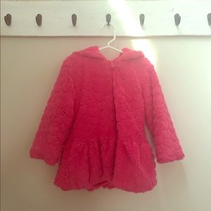 Girl’s hot pink winter coat.